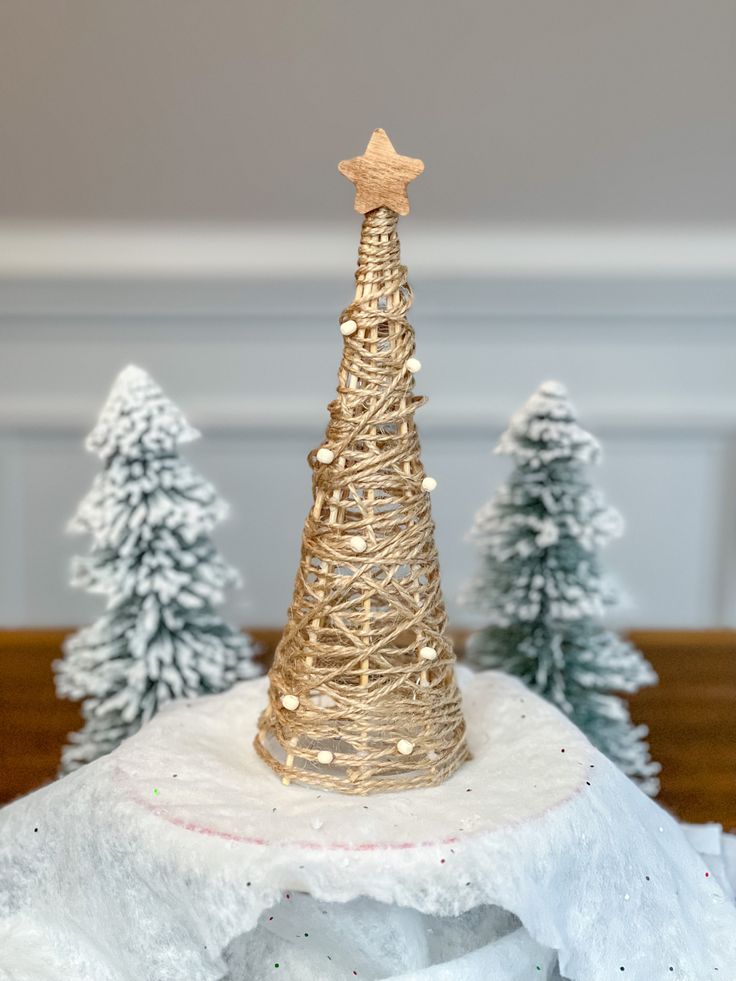 a small christmas tree sitting on top of a table