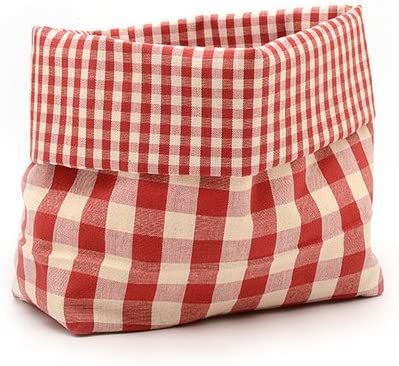 a red and white checkered bag sitting on top of a table