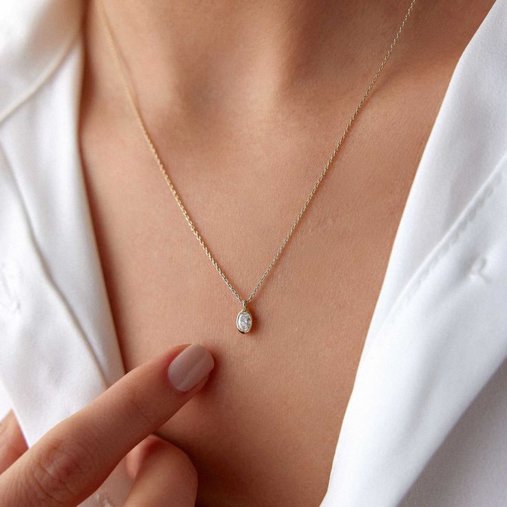 Our simple and elegant solitaire diamond necklace bezel set on 14k/18k solid gold upon your preference.★ Necklace Features• Gold Kt: 14K/18K Solid Gold - According to preference• Available Gold Colors: Yellow Gold, White Gold, Rose Gold• Center Diamond Weight: 0.20 carat• We only work with real natural diamonds• We include a signed certificate with each necklace for the authenticity of the diamonds Minimalist 14k Gold Diamond Necklace With Bezel Setting, Dainty 14k Gold White Solitaire Necklace, Dainty White Solitaire Necklace In 14k Gold, Everyday White Diamond Necklace In 14k Gold, 14k Gold Solitaire Diamond Necklace, Dainty 14k Gold Solitaire Diamond Necklace, Minimalist White Diamond Necklace In 14k Gold, Delicate 14k Gold Solitaire Diamond Necklace, Minimalist 14k Gold Solitaire Necklace