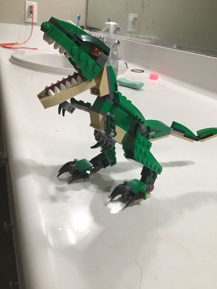 a lego dinosaur that is sitting on a table