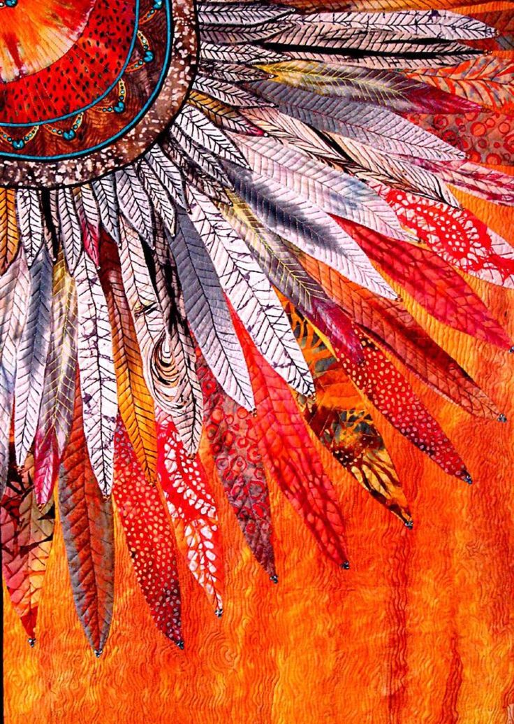 an orange and white painting with feathers on it