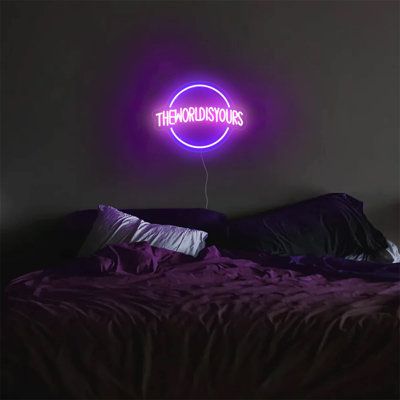 a purple neon sign that reads the ridiculous ones on it's wall above a bed