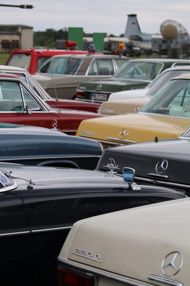 many old cars are parked in a parking lot