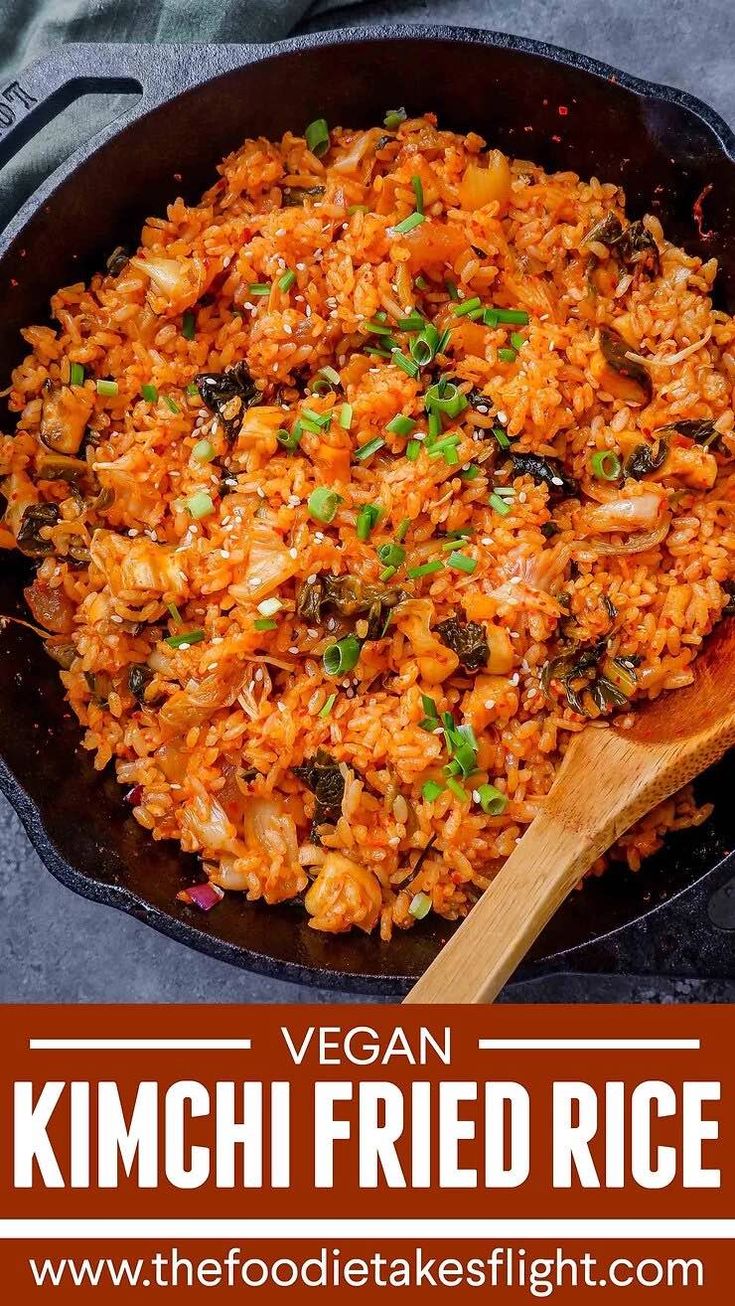 vegan kimchi fried rice in a skillet with wooden spoon