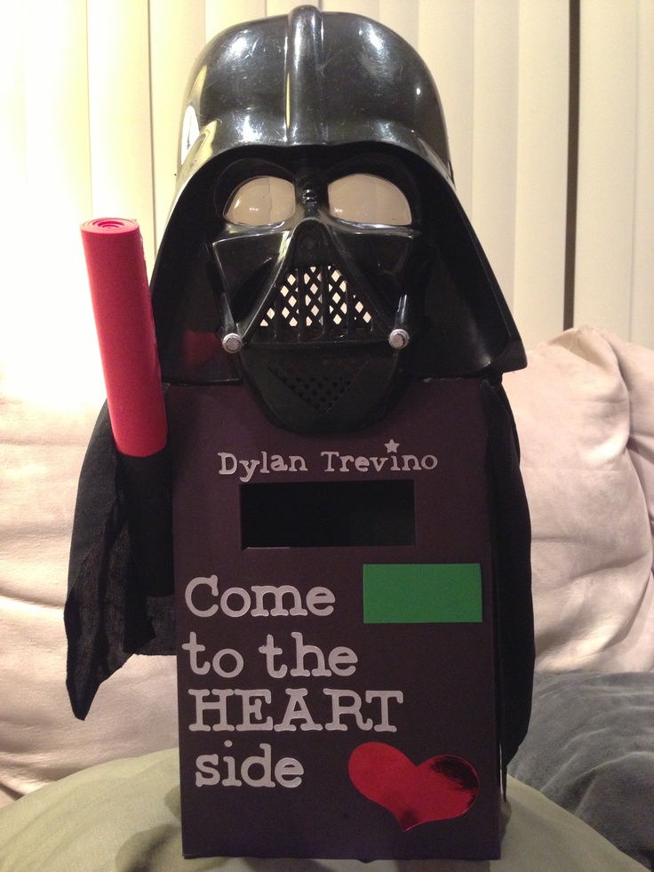 a darth vader cardboard box with the words come to the heart side