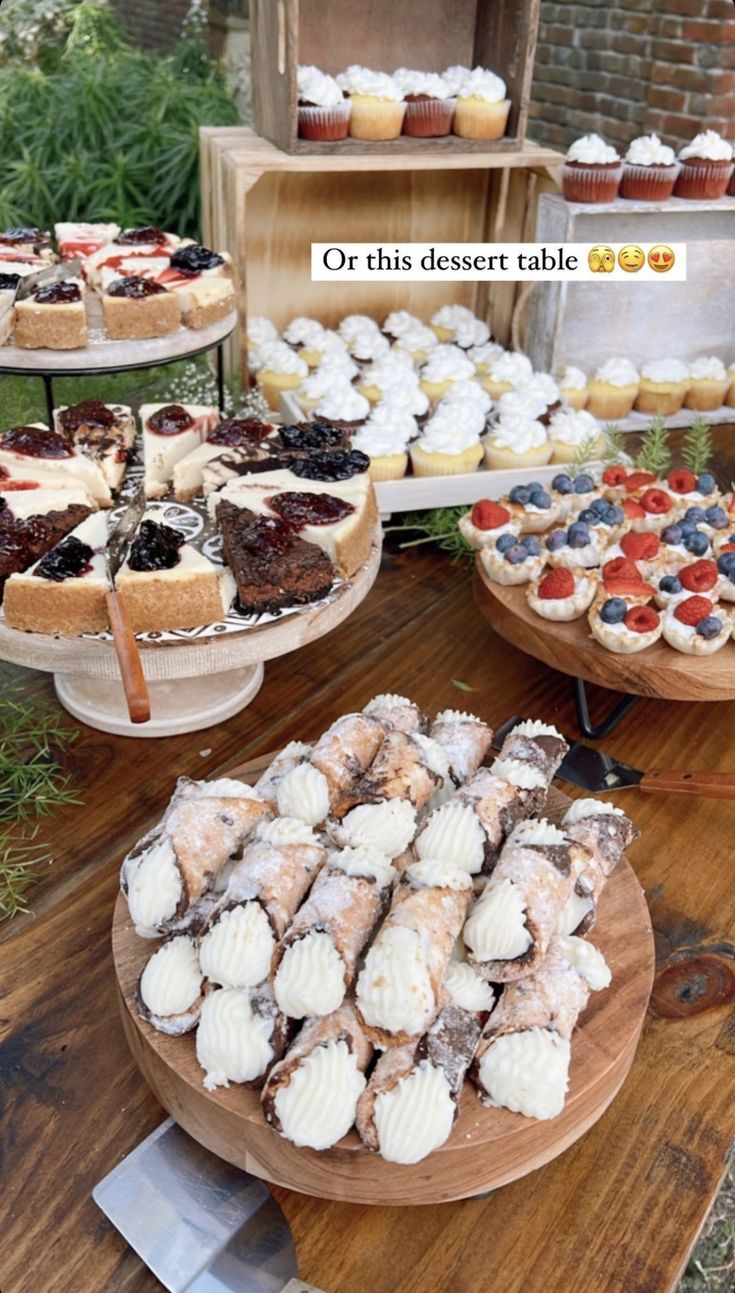 desserts and pastries are displayed on wooden platters