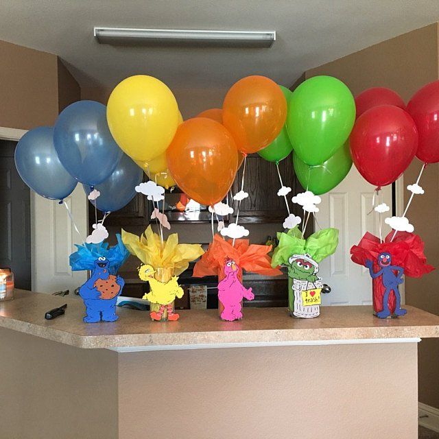 there are many colorful balloons on the counter