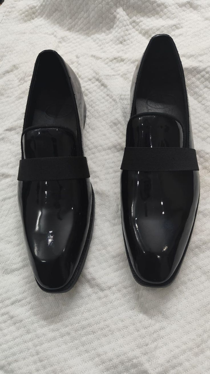 Elegance meets comfort in our handmade loafer, meticulously crafted to perfection. The shoe boasts a timeless loafer design, featuring a sleek waistband that adds a touch of sophistication to your footwear. Material: Only the finest top-quality patent black leather is used in the creation of this shoe. This leather not only exudes a luxurious sheen but also offers exceptional durability, ensuring your investment in style will stand the test of time. Toe: The soft chiseled toe adds a unique chara Formal Fitted Leather Slip-ons, Semi-formal Patent Leather Slip-on Loafers, Modern Formal Slip-ons With Almond Toe, Modern Black Tassel Loafers For Formal Occasions, Modern Black Moccasins For Formal Occasions, Modern Black Loafers For Formal Occasions, Sleek Black Patent Leather Loafers, Modern Black Formal Moccasins, Modern Tassel Loafers With Leather Sole For Formal Wear