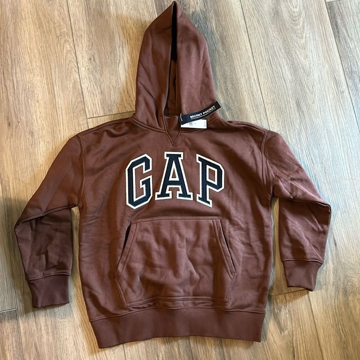 Brand New Gap Hopdie Fits A Woman’s Size Small Or Xs Gap Hoodie With Ribbed Cuffs For Streetwear, Sporty Gap Hoodie For Fall, Gap Casual Hoodie With Adjustable Hood, Gap Hooded Hoodie For Fall, Gap Hoodie With Adjustable Hood For Streetwear, Gap Hooded Tops With Ribbed Cuffs, Gap Sweatshirt With Adjustable Hood For Fall, Gap Fleece Hoodie For Fall, Casual Gap Tops With Drawstring Hood