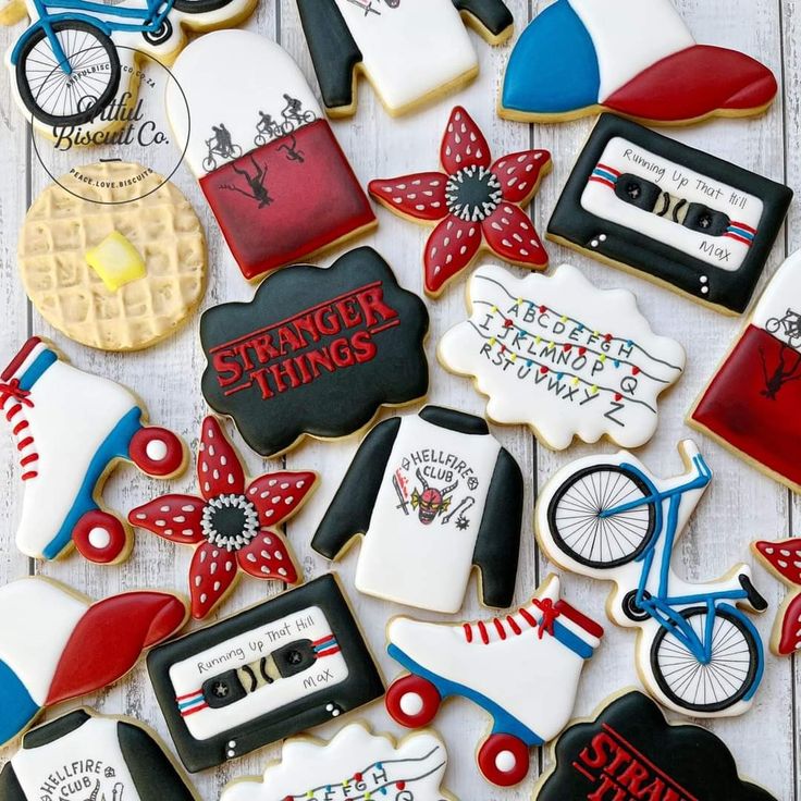 some decorated cookies are laying on a table