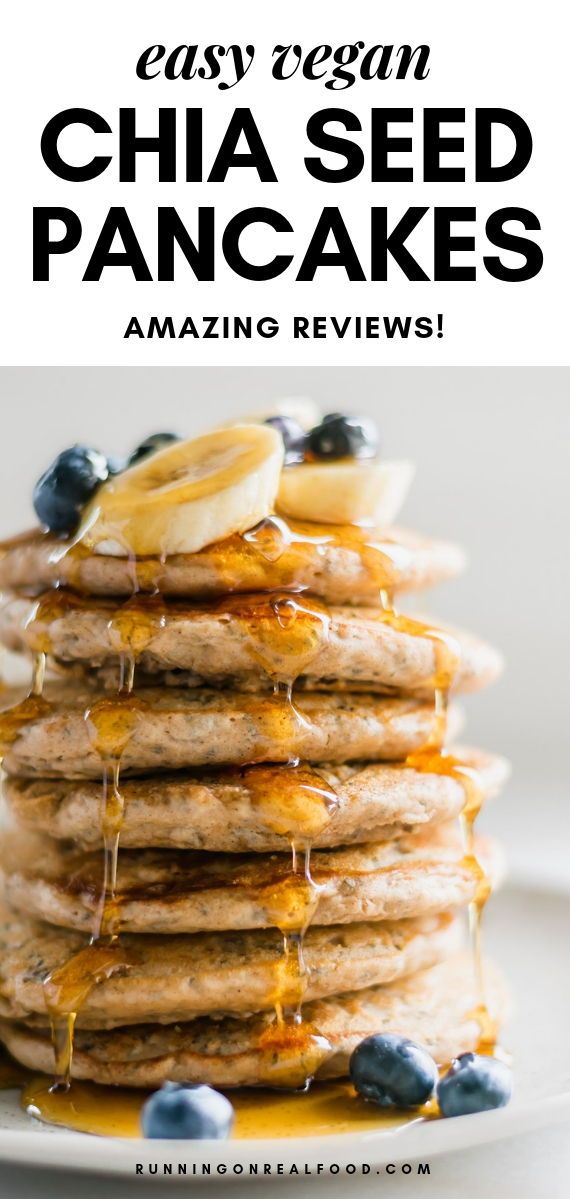 pancakes stacked on top of each other with blueberries and bananas drizzled over them