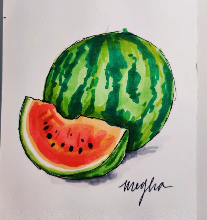 a watermelon cut in half on a white surface