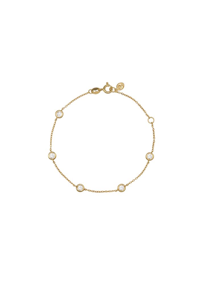 The Clemence bracelet features a delicate strand of five 0.10-carat round cut stones bezel-set in 18-karat gold-coated sterling silver. Adjustable by one inch for your preferred fit. The Fine Print: Metal: 18k Gold-coated sterling silver Setting: Bezel set Stone Type: Lab-grown white sapphire Stone Shape: Round cut Clo Dream Bracelet, Vs1 Diamond, Accesories Jewelry, The Fine Print, Ring Chain, Fine Print, Jewelry Photography, Strand Bracelet, Sapphire Stone