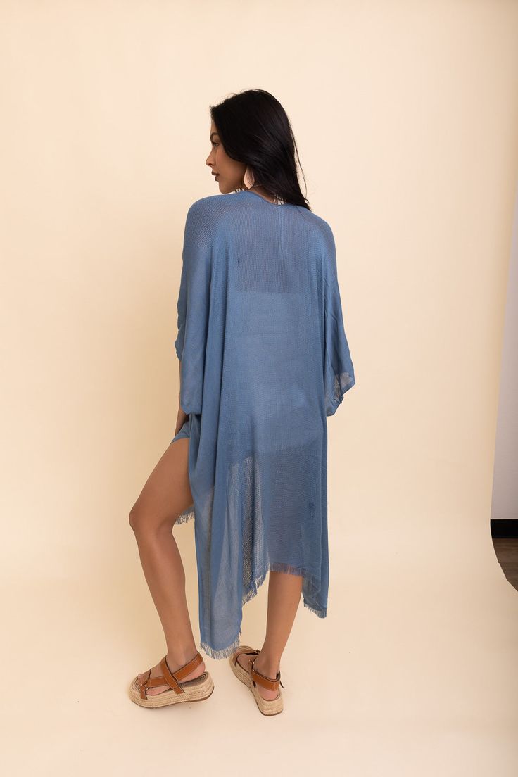 Flaunt your free-spirited style this summer with our Sun-kissed Breeze Frayed Trim Kimono! Perfect for vacations and weekend festivities, the kimono’s lightweight design is bound to keep you cool and comfortable. A layer of frayed trim along the borders adds an extra touch of texture and playfulness that is irresistible. The bright colors are bound to make you stand out so get ready to turn heads! Not only is it perfect for completing any beach-look, but also great to add a little extra flair to Bohemian Lightweight Cover-up For Day Out, Blue Breezy Summer Cover-up, One Size Long Cover-up For Day Out, Blue Breezy Flowy Cover-up, Blue Flowy Breezy Cover-up, Lightweight Wrap Beach Cover-up, Chic Tunic Cover-up For Beach Season, Vacation Beach Cover-up Kimono With Kimono Sleeves, Beachwear Wrap Cover-up For Loungewear