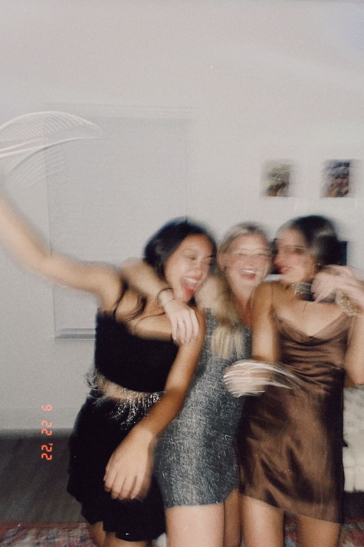 three young women are posing for the camera