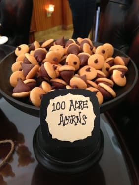 a plate full of cookies that have been decorated with the words 100 acorns