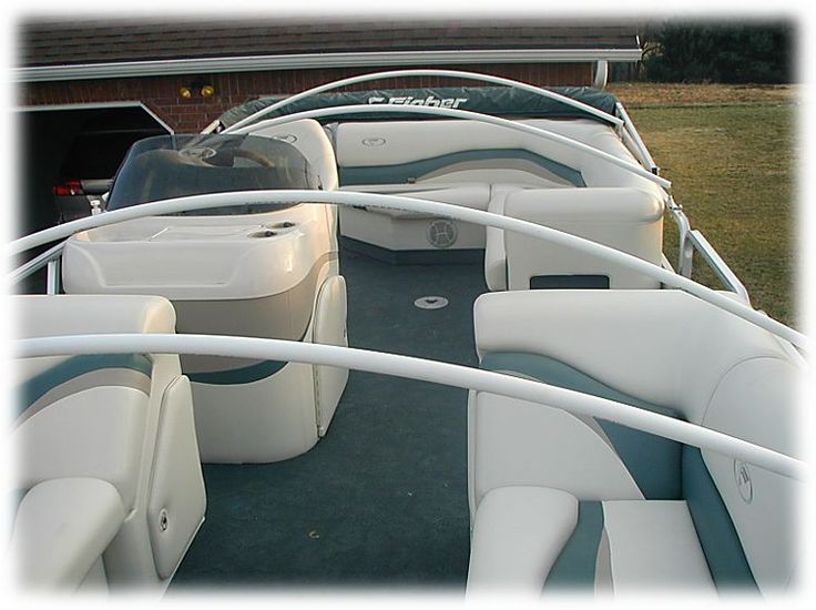 several boats are lined up in the yard