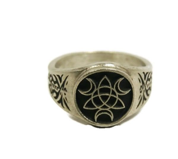 This ring was designed with the Triple Moon Goddess symbol along with a Trinity symbol. Maiden, the Mother, and the Crone. Each symbolizes both a unconnected stage in the female life cycle and a phase of the Moon, and often rules one of the realms of heavens, earth, and underworld. In many forms of Wicca, her masculine consort is the Horned God. The beautiful pewter ring is a silver color and the background is blackened to bring out the fine detail of the design. Our rings are 100% Lead and nick Symbolic Moon-shaped Adjustable Rings, Adjustable Moon Shaped Symbolic Rings, Triple Moon Goddess Symbol, Moon Goddess Symbol, Trinity Symbol, Goddess Hecate, Goddess Symbol, David Ring, Horned God