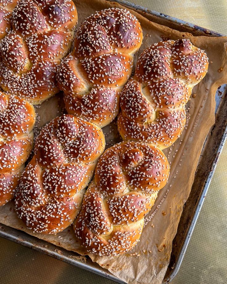 freshly baked hot cross buns in a baking pan ready to be eaten for lunch