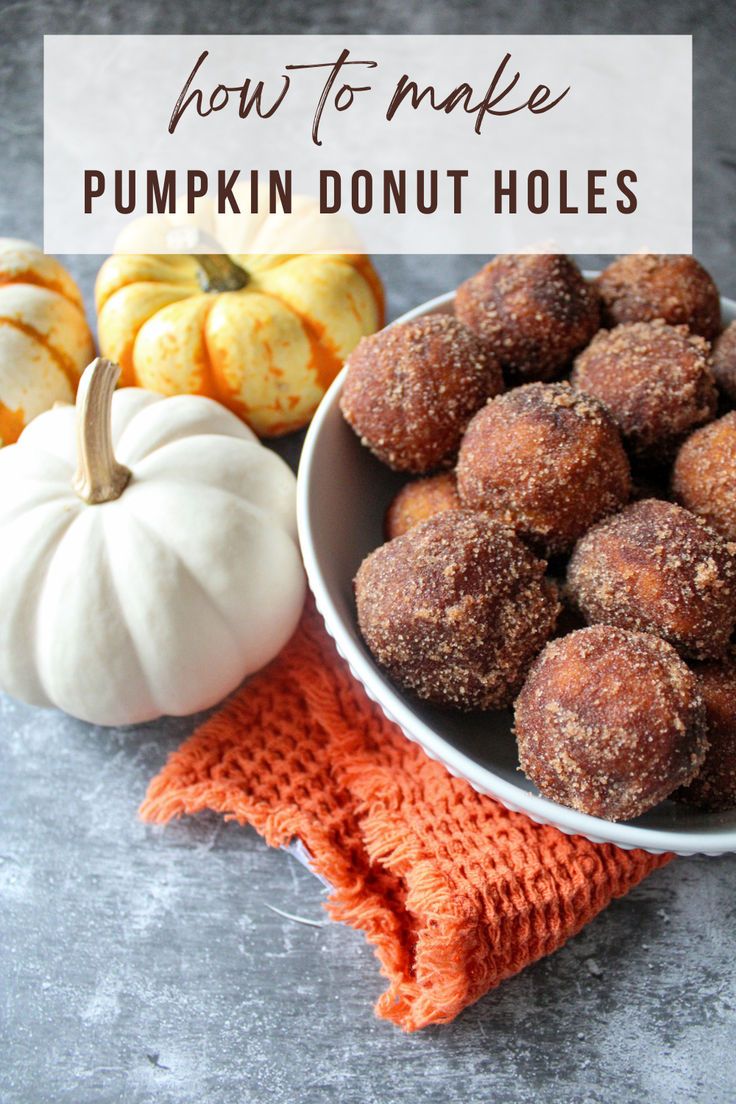 pumpkin donut holes in a white bowl on top of an orange towel next to mini pumpkins