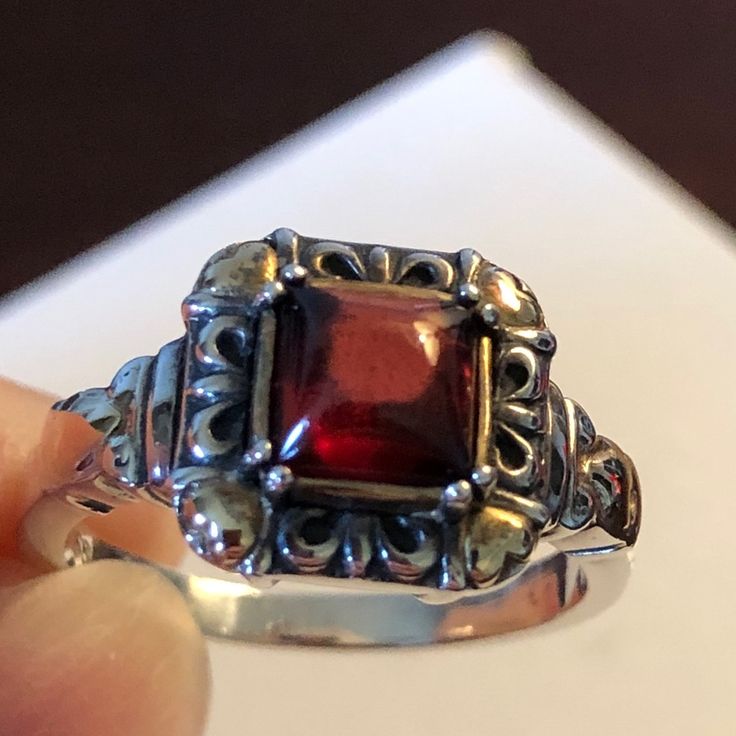 Sterling Silver And 14kt Yellow Gold (Stamped 925/585) Cabochon Cut Garnet Ring. Artisan Crafted. Square Center Cabochon Red Garnet, 4 Prong Set , Measures 4 X 4 Mm And Approximately 1/2 X 1/2” With 14kt Yellow Gold Heart Accents. Ring Size Approximately 7 Which Can Be Resized Easily. Red Garnet Ring, Garnet Ring, Brooch Jewelry, Garnet Rings, Red Garnet, Artisan Craft, Gold Heart, Heart Of Gold, Womens Jewelry Rings