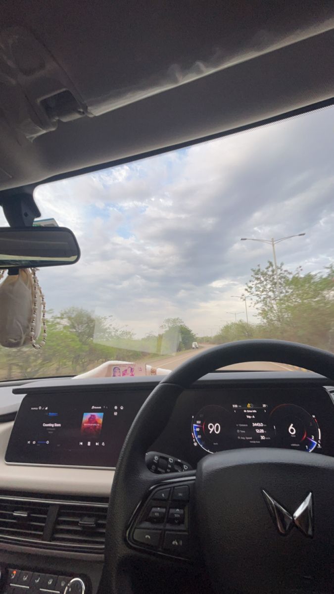 the interior of a car with dashboard and steering wheel