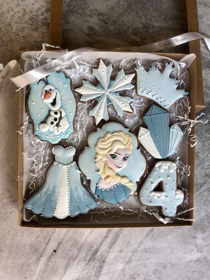 frozen princess cookies in a box on a table