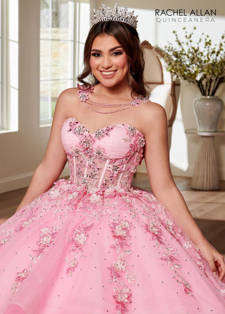 Impress your guests in this 3D floral applique long sheer corset dress with A-line skirt by Rachel Allan RQ3119. Strapless glitter tulle quinceanera ball gown features sweetheart corset bodice, detachable bodice liner, ruched bust, beading and lace applique on bodice and skirt overlay, matching necklace, detachable sleeves, detachable bow, lace-up back closure, and sweep train. Applique Sheer Corset Quinceanera Dress by Rachel Allan RQ3119 Rachel Allan Alta Couture Collection: Fall 2023 Style Nu Mori Lee Quinceanera Dresses, Bow Gown, Beige Blond, Sheer Corset, Tulle Balls, Satin Tulle, Rachel Allan, Mori Lee, Quinceanera Dress