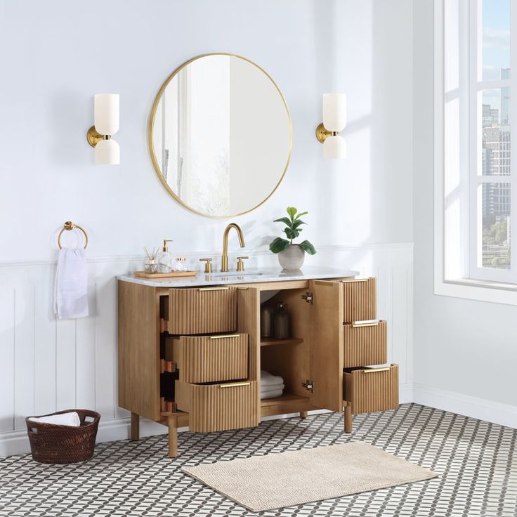 a bathroom with a sink, mirror and rug