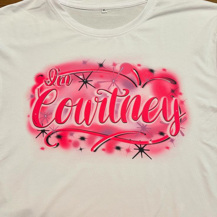 a white t - shirt with the words i'm coutney on it