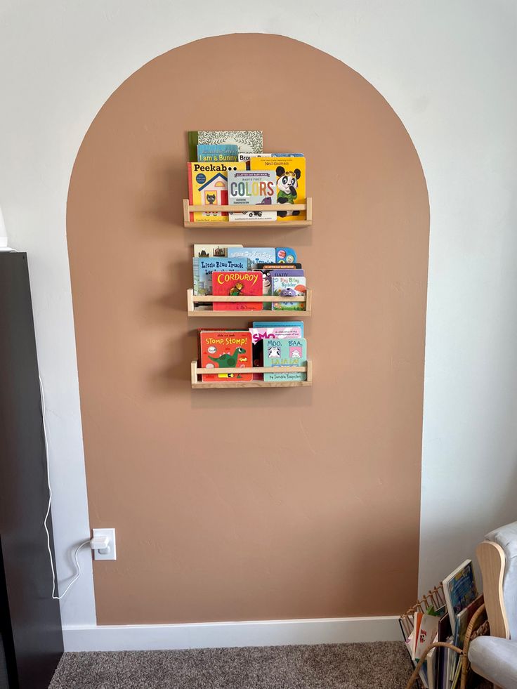 two bookshelves on the wall with children's books