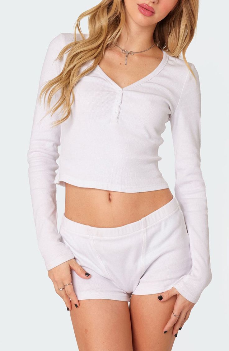 Comfy yet cool, this cropped henley is crafted with fine allover ribbing for a close fit. Button half-placket V-neck Long sleeves 95% cotton, 5% spandex Machine wash, dry flat Imported Spring Fitted Henley With Henley Neckline, White Cropped Crop Top With Button Closure, Cropped Henley, Henley Top, Nordstrom, Long Sleeves, Spandex, V Neck, Wardrobe