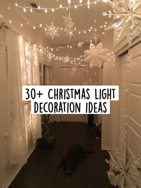 the hallway is decorated with christmas lights and snowflakes on the ceiling, along with a black cat