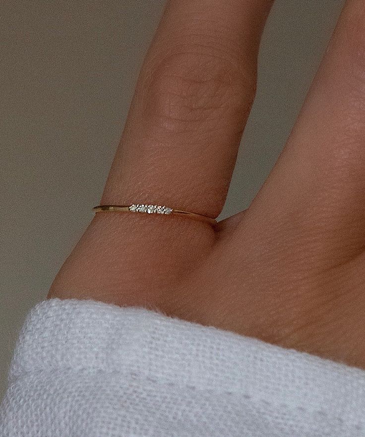 Solid 14k gold with 5 bright white genuine diamonds. A very tiny ring, perfect to stack. This pinky ring can be selected as open in the back so it is adjustable. If open back, it can be adjusted yourself to be as small as a size 2 and as large as a 4.5, including every size in between. It can also be worn as a knuckle ring! The closed back version is much more durable. If you plan to wear this ring 24/7 it is recommended to order the closed back. Available in an adjustable one size fits all open back style, or as a closed single sized ring. Please note the closed size is custom made to order and final sale, be sure of your ring size. Also available in 14k rose gold, email info@belladaar.com to order. Dainty Pinky Ring, Women’s Pinky Rings, Tiny Diamond Jewelry, Diamond Pinky Ring For Women, Gold Pinky Ring Women, Pinkie Rings For Women, Pinky Promise Rings, Gold Ring Ideas, Gold Pinky Rings