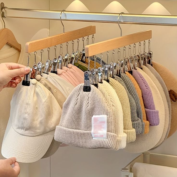 a rack with hats hanging from it's hooks