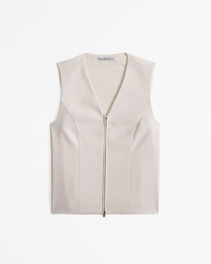 Women's Tailored Zip Vest | Women's Tops | Abercrombie.com Spring V-neck Top With Zipper Closure, Sleeveless Workwear Vest With Zipper Closure, Zipper Closure Sleeveless Vest For Work, V-neck Tops With Zipper Closure For Spring, Spring V-neck Tops With Zipper Closure, Elegant Spring Tops With Zipper Closure, Elegant Fitted Tops With Zipper Closure, Elegant Workwear Top With Zipper Closure, Fitted V-neck Tops With Zipper Closure