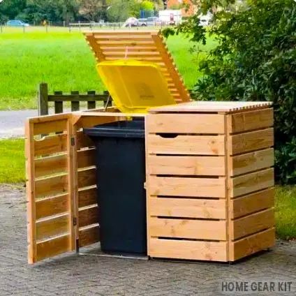 a large wooden box with a yellow plastic trash can