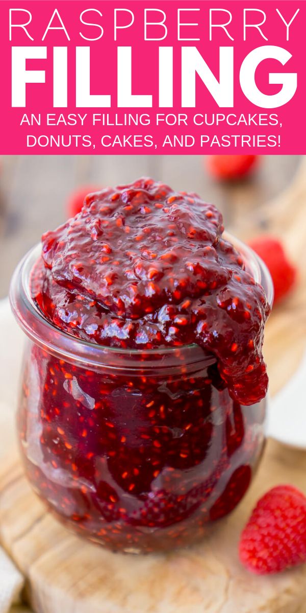 raspberry filling in a glass jar on a cutting board