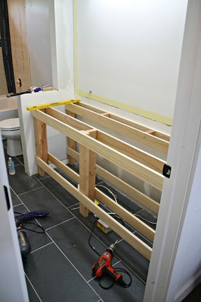 an unfinished bathroom with tools on the floor