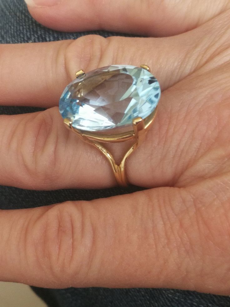 This beautiful vintage ring was found in southern Indiana, close to the Kentucky border. This goreous ring weighs 9.6 grams, and the oval Swiss Blue Topaz measures 20x16mm. That's approximately 15 carats! If you want a classic statement ring, this is it. I'ts a size 6 1/2. Antique Oval Topaz Ring For Formal Occasions, Oval Heirloom Topaz Ring For Formal Occasions, Formal Oval Ring With Large Stone, Oval Topaz Ring For Formal Occasions, Classic Oval Topaz Ring Hallmarked, Formal Oval Hallmarked Topaz Ring, Formal Oval Topaz Ring Hallmarked, Formal Oval Topaz Gemstone Ring, Heirloom Oval Topaz Ring Hallmarked