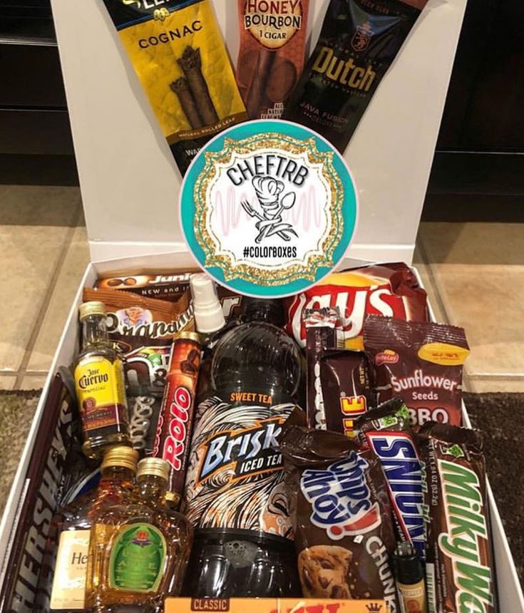 a box filled with lots of different types of beer and chocolates on top of a counter