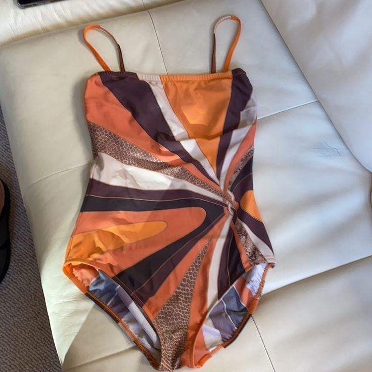 Gorgeous Gottex Three- Pieces Swim- Set: One Piece Bandeau- Style Swimsuit With Two Detachable Straps And Soft- Lined Bust And 100 % Silk Semi- Transparent Maxi Wrap With Long Ties Which Could Be Worn As A Skirt Or As A Strapless Cover Dress. Beautiful Pattern With Gold Foil Accents.Both Are In Excellent Condition ( Wrap Was Never Worn) . Striking Resort Beach Attire!- Guaranteed To Turn Heads!!! Swimsuit Is Listed As 12, But Fits Closer To 8-10. Wrap Is Listed As L , But Could Be Easily Wrapped Orange Bodysuit For Summer Parties, Summer Swimming Bodysuit In Orange, Orange Beachwear Bodysuit For Summer, Summer Orange Bodysuit For Swimming, Orange Stretch Bodysuit For Summer, Stretch Orange Bodysuit For Summer, Sleeveless Brown Swimwear For Party, Orange Sleeveless Bodysuit For Beach Season, Sleeveless Orange Bodysuit For Vacation