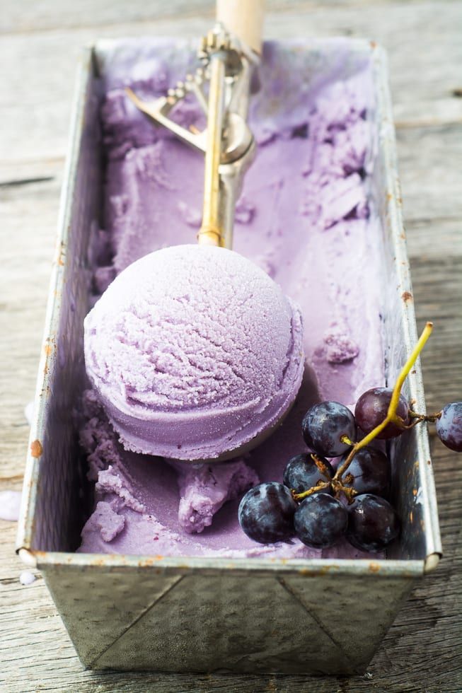 a scoop of ice cream with grapes in it