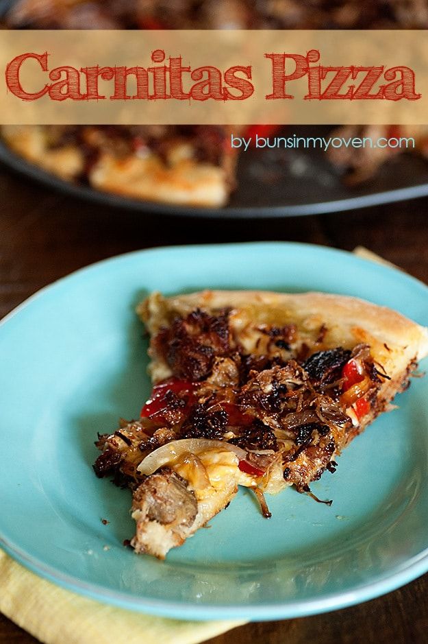 a piece of pizza on a blue plate with the words carnitas pizza above it