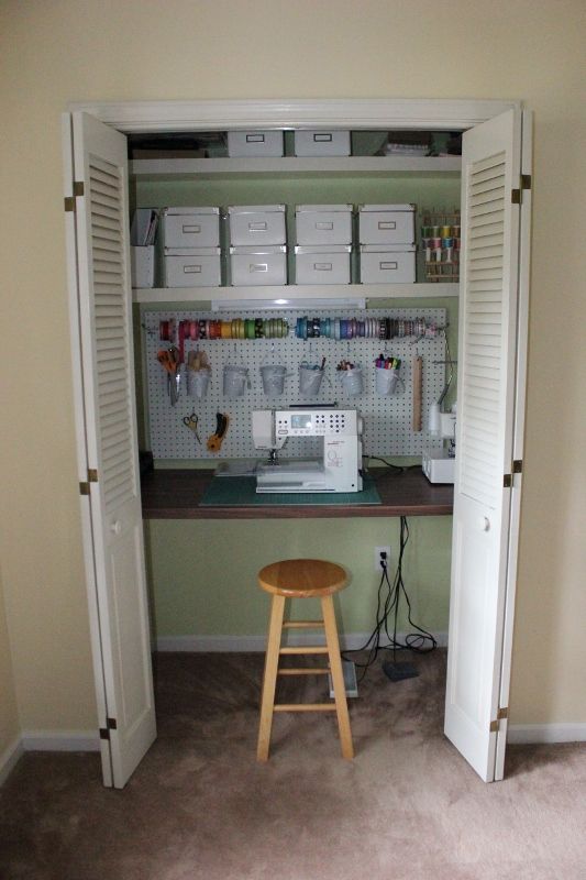 a sewing machine sitting on top of a wooden stool in a room with open doors