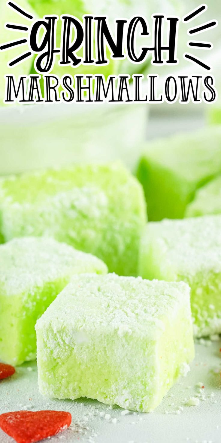 green and white marshmallows on a table with text overlay that reads grinch marshmallows