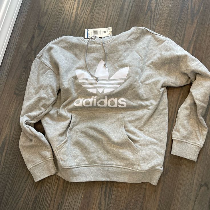 Light Grey Hoodie With White Adidas Logo- Size Medium Crew Neck Hoodie With Logo Print For Spring, Hooded Sweatshirt With Logo Print For Spring, Adidas Athleisure Hoodie With Crew Neck, Spring Athleisure Sweatshirt With Kangaroo Pocket, Spring Sports Sweatshirt With Kangaroo Pocket, Athleisure Logo Print Sweatshirt For Spring, Spring Athleisure Sweatshirt With Logo Print, Spring Sports Sweatshirt With Logo Print, Adidas Casual Sweatshirt For Sports