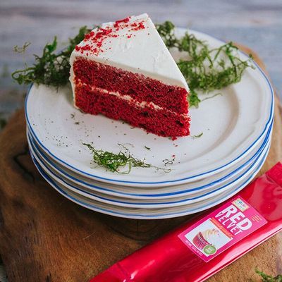 a piece of red velvet cake sitting on top of plates