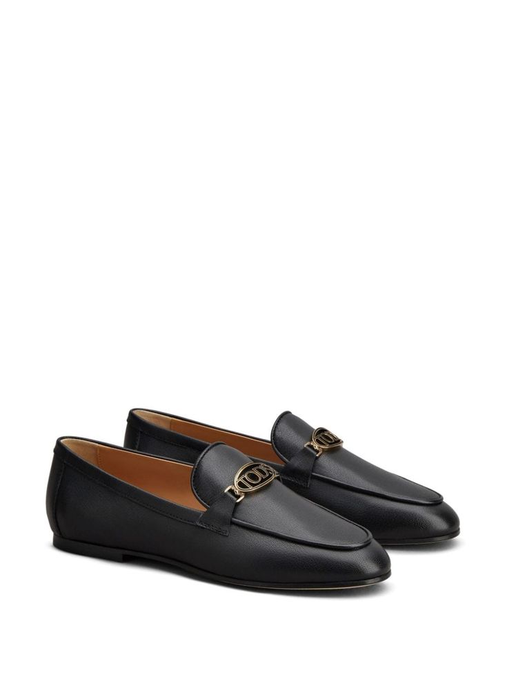 Step into luxury and comfort with these sleek and stylish loafers that effortlessly elevate any outfit. Perfect for both casual and formal occasions, they exude sophistication with a touch of fun. You'll love how easy they are to slip on and the timeless elegance they bring to your wardrobe. Jet black leather Smooth grain Gold-tone hardware Almond toe Slip-on style Branded leather insole Flat leather sole Oval Logo, Black Leather Loafers, Leather Cap, Mens Gloves, Beach Tote Bags, Leather Loafers, Jet Black, Handbag Backpack, Loafers For Women