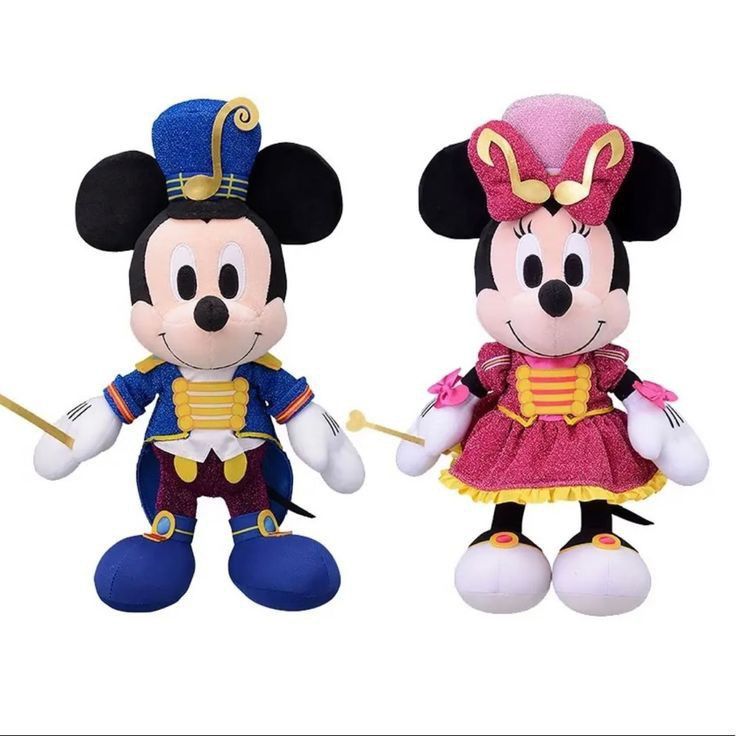 two mickey and minnie mouse stuffed animals are shown in front of each other on a white background